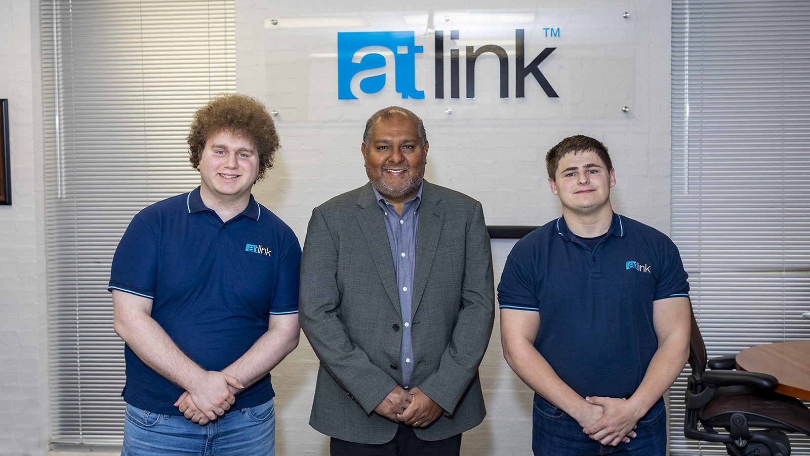 UHCL alumnus Dilhar De Silva, pictured with IT specialists like Ryan Brooker and Joseph Bittinger
