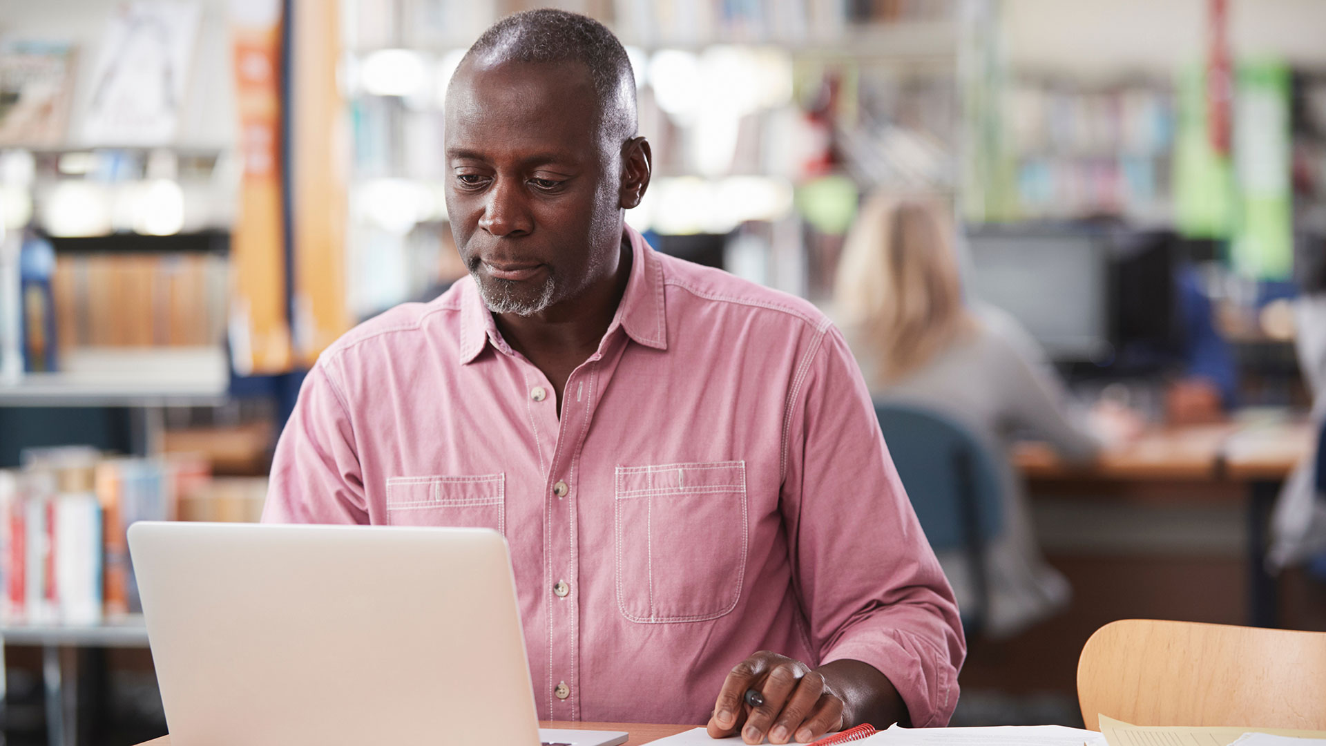 MBA student sitting at desk