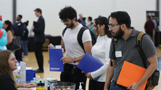 Photo of UHCL student visiting a career event table