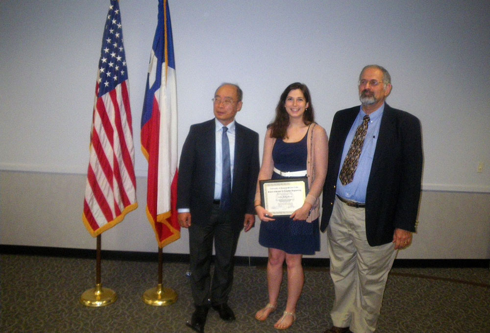 Josi Robertson accepts the Outstanding Environmental Science Graduate Student Award