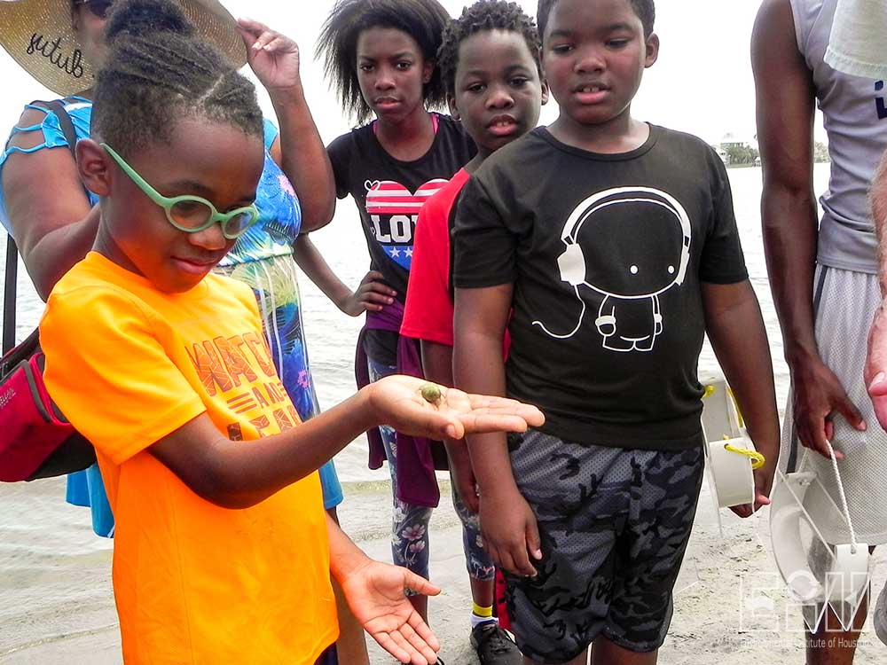 Student holds a hermit crab