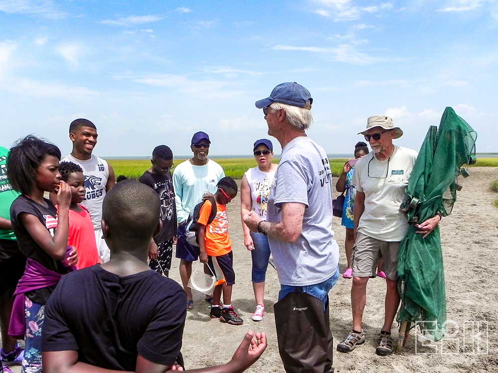 Master Naturalists explain seining to STEM Foundation students