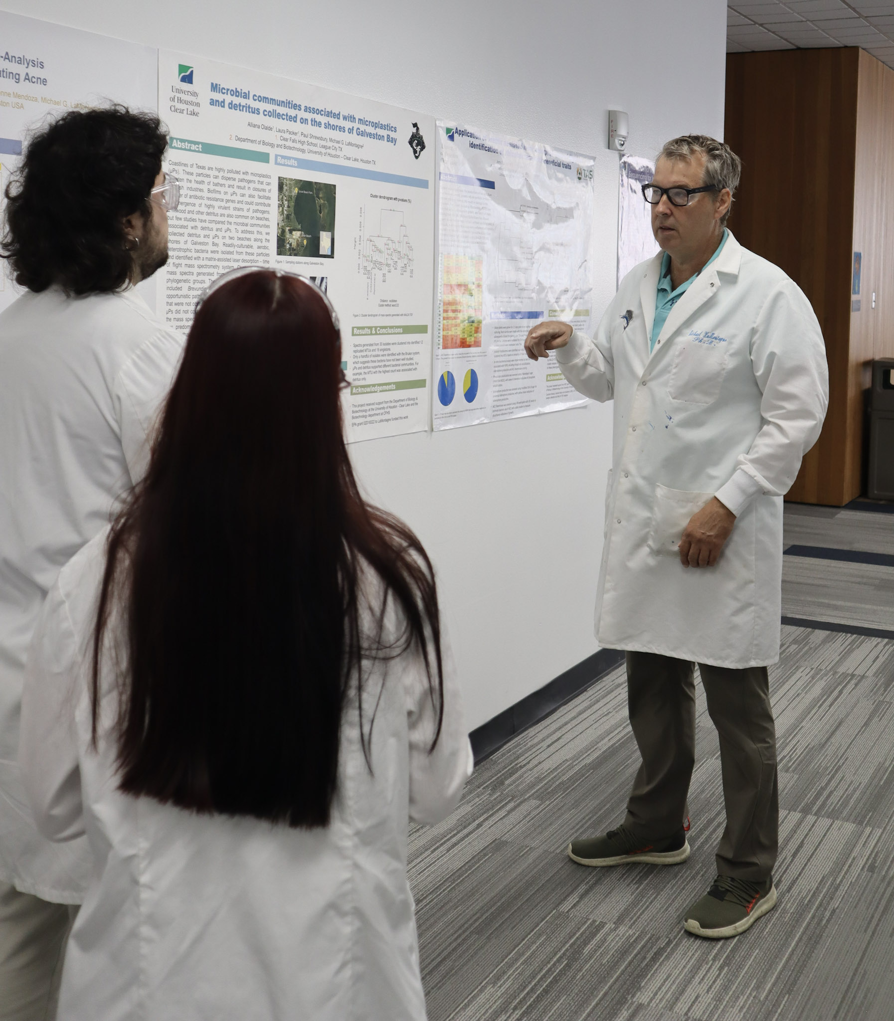 As students enter Dr. Michael LaMontagne’s lab, he reminds them to put on goggles. 