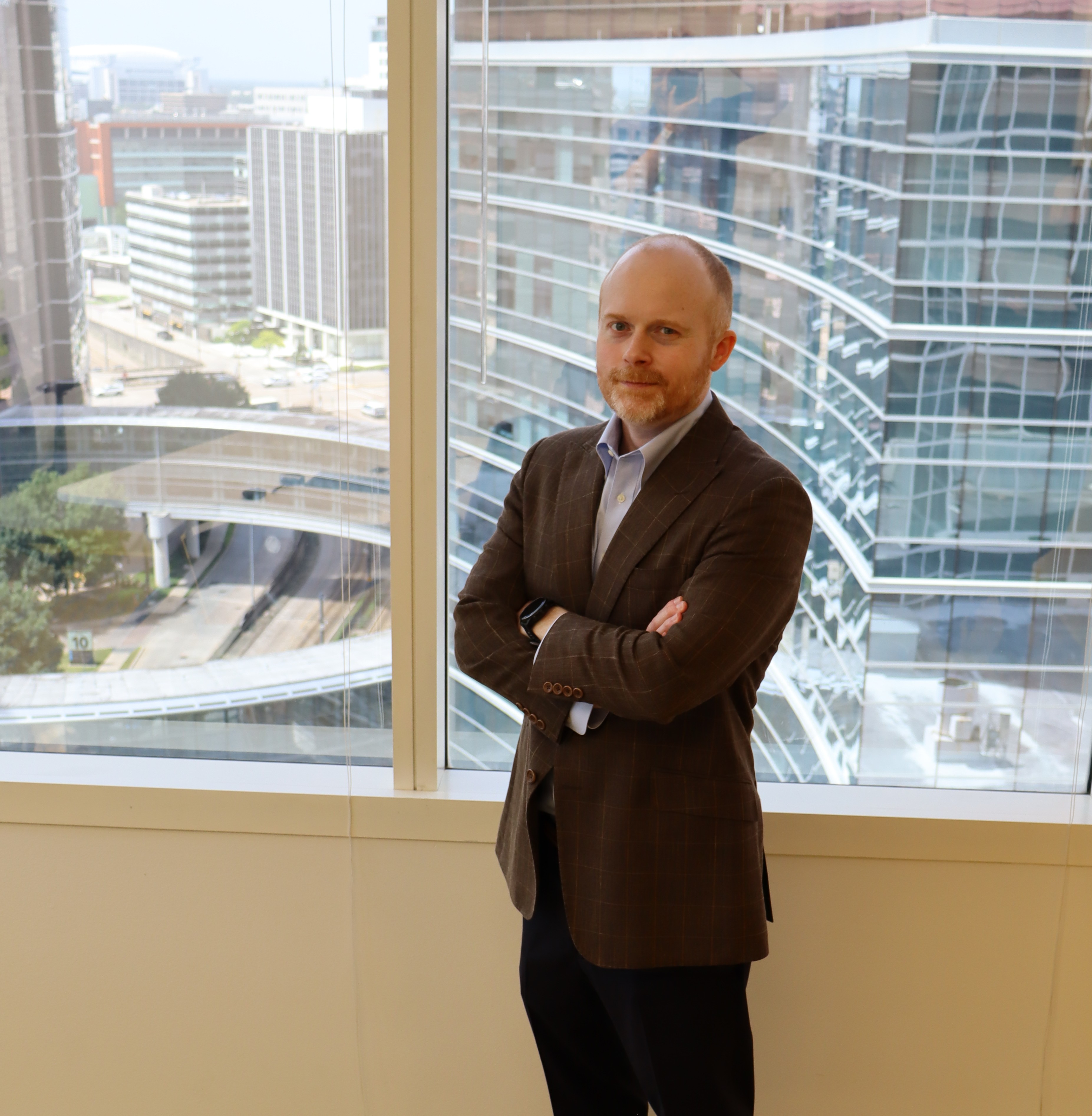 Photo of Dr. Jordan Mitchell near TMC building