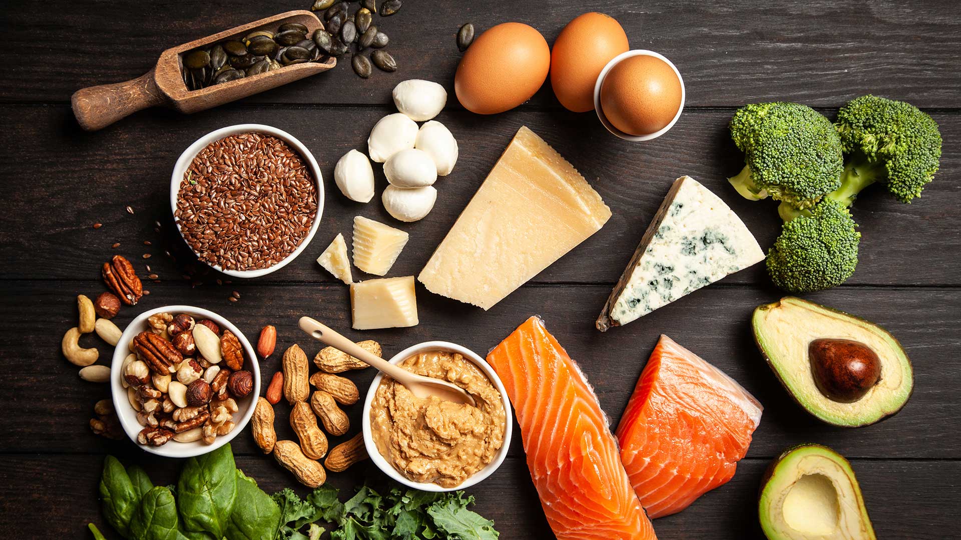 Various food arranged on a wooden surface