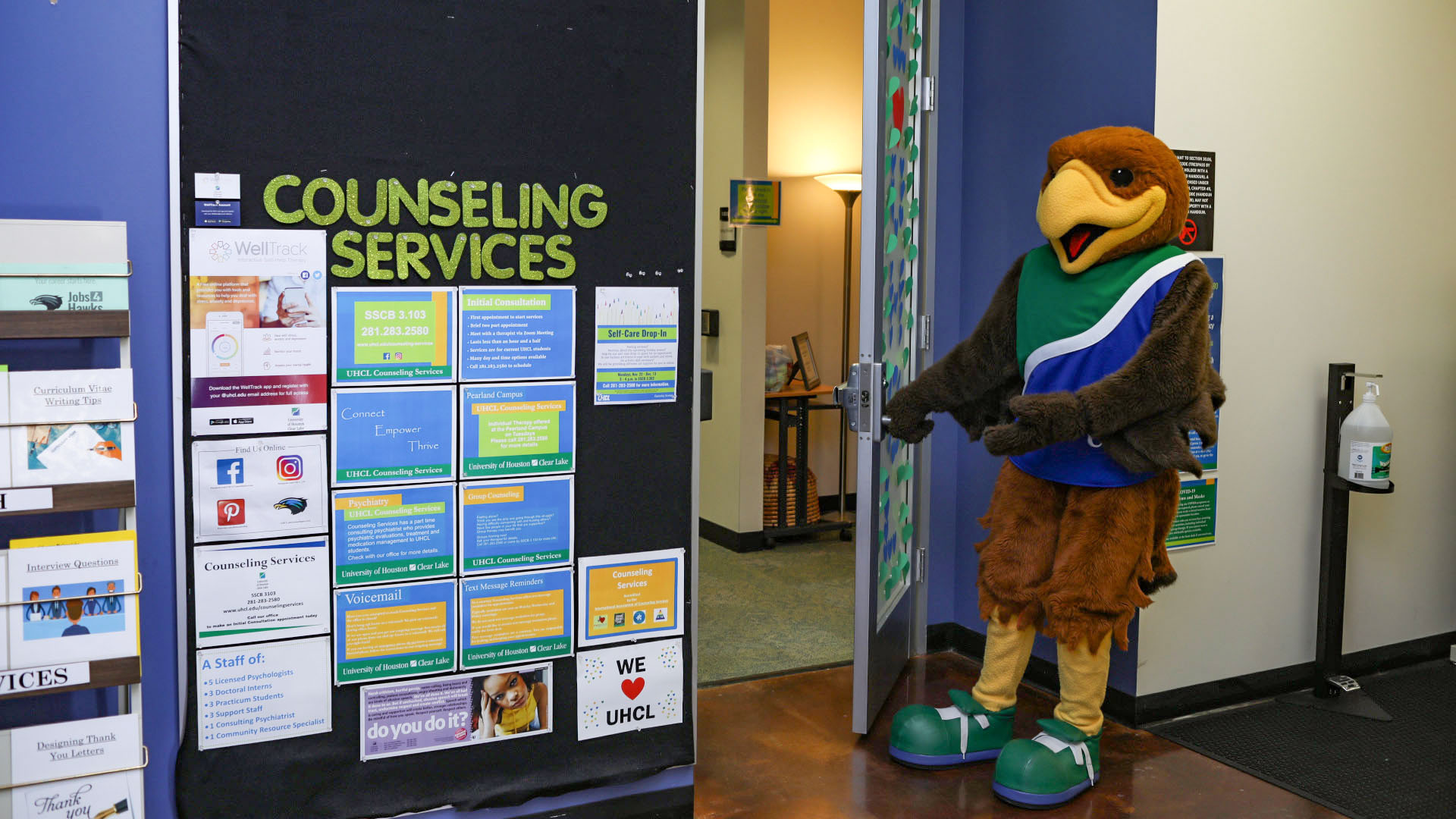 Hunter Hawk opening the door to the Counseling Services office