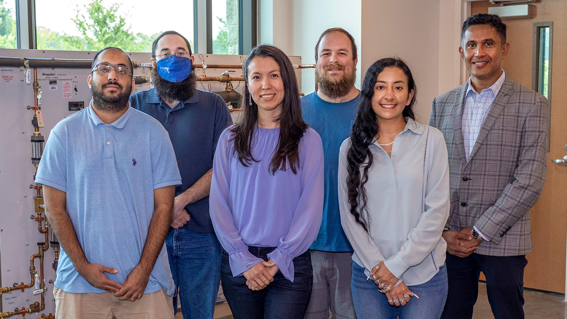 First place winners are from left, front row: Jaseem Muhammad, Glenda Rubio, Aline Lira. Back row: Ryan Jarnagin, Martin Demaret, Dr. Ariful Bhuiyan.