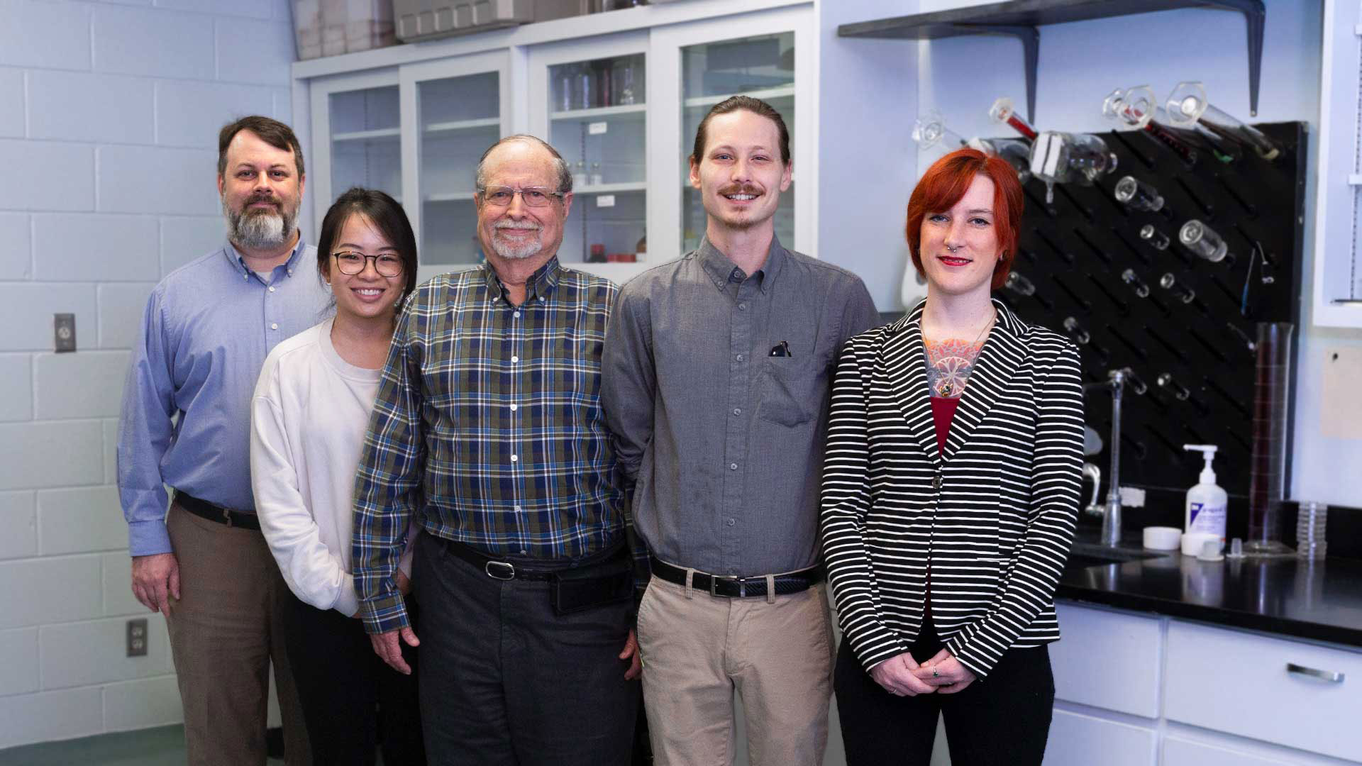 A group of faculty in a lab