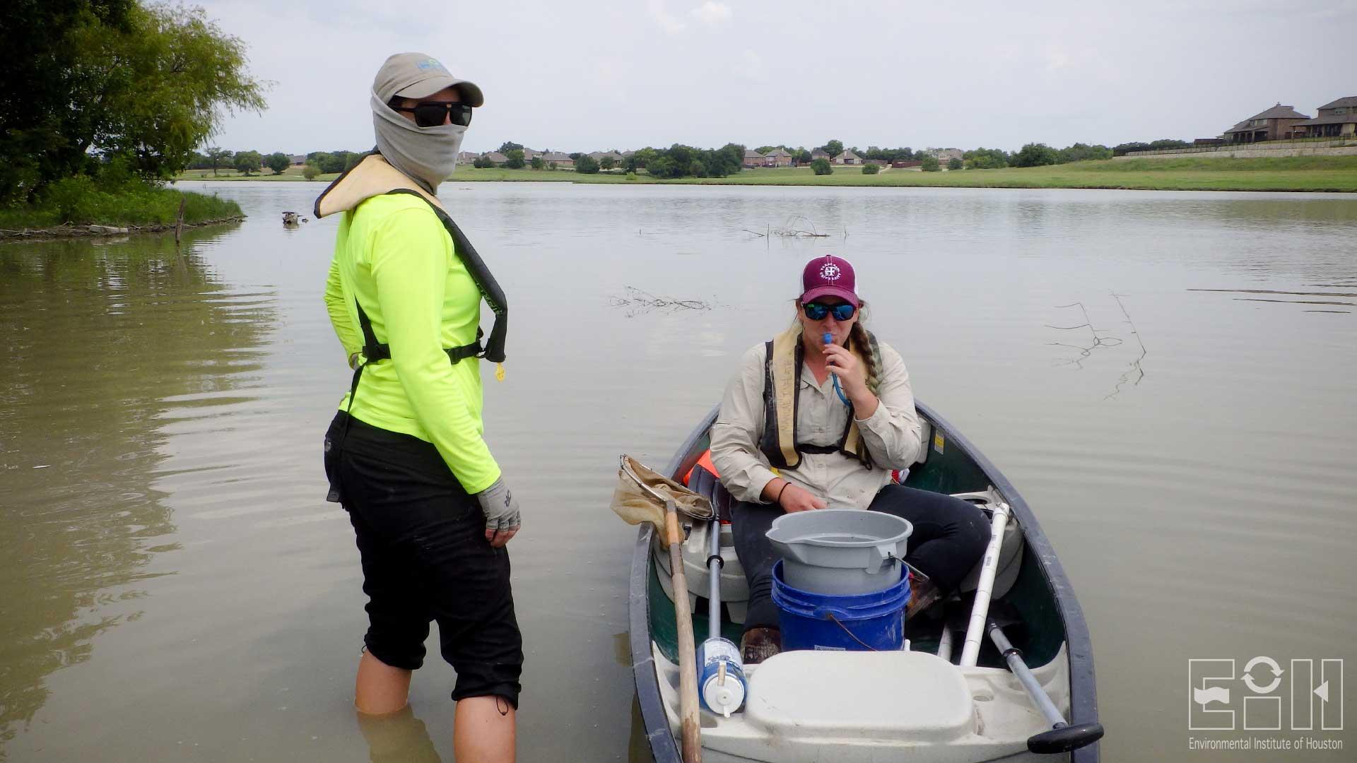 Jo Vaughn and Emily Miller, lentic ecology technicians, at a site in Rockwall.