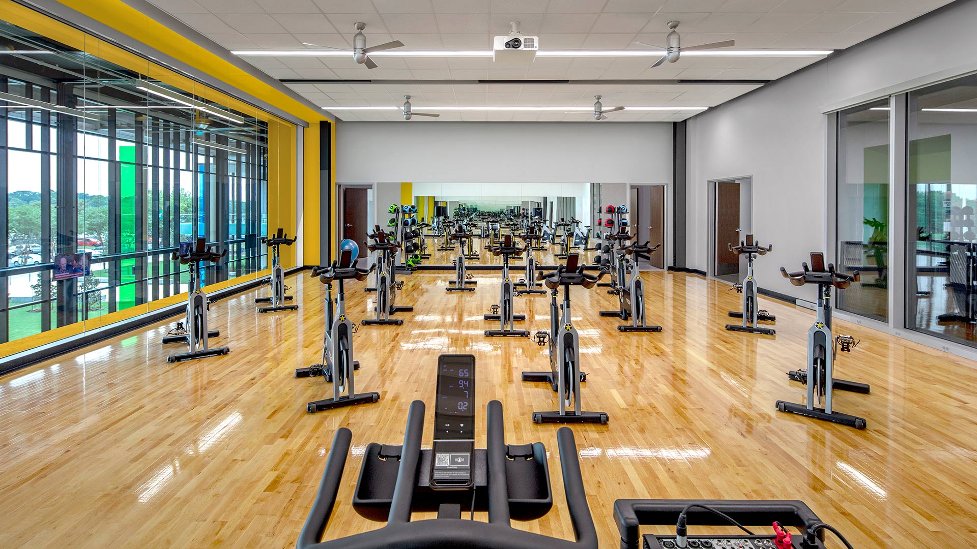 Multi-purpose room with stationary bikes arranged for a class