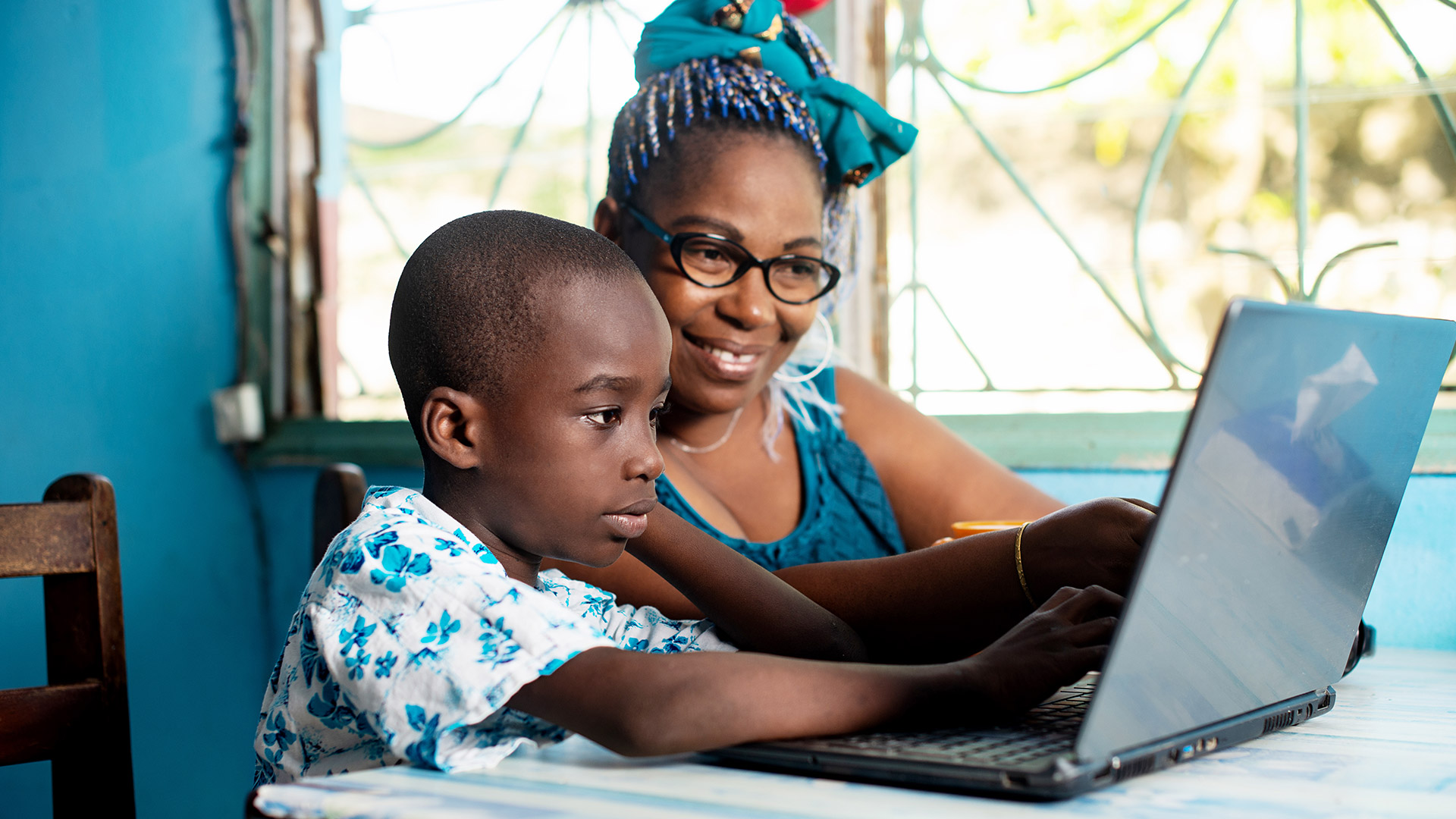 Woman and child in front of laptop