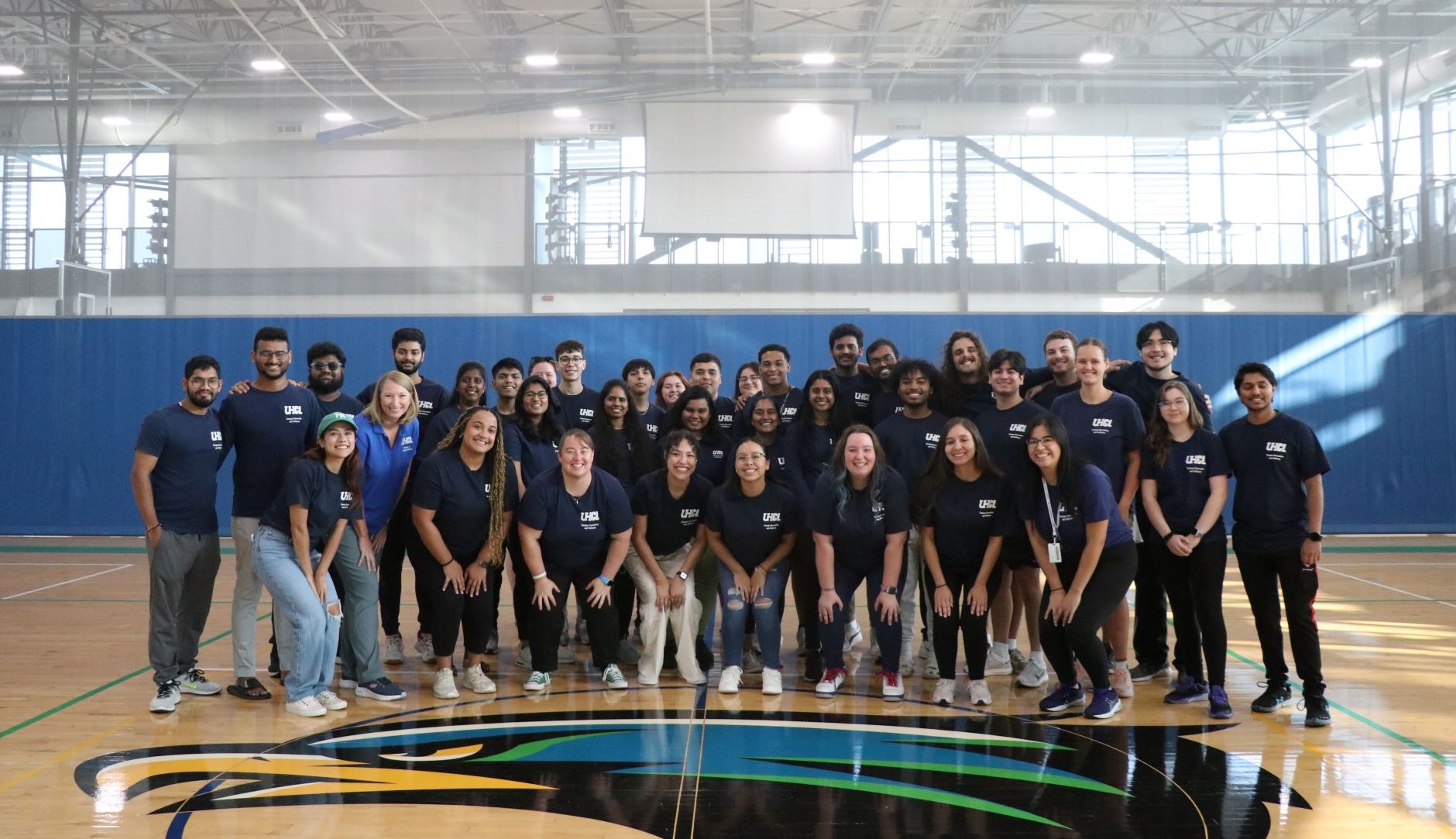 Recreation and Wellness staff inside on court 1 