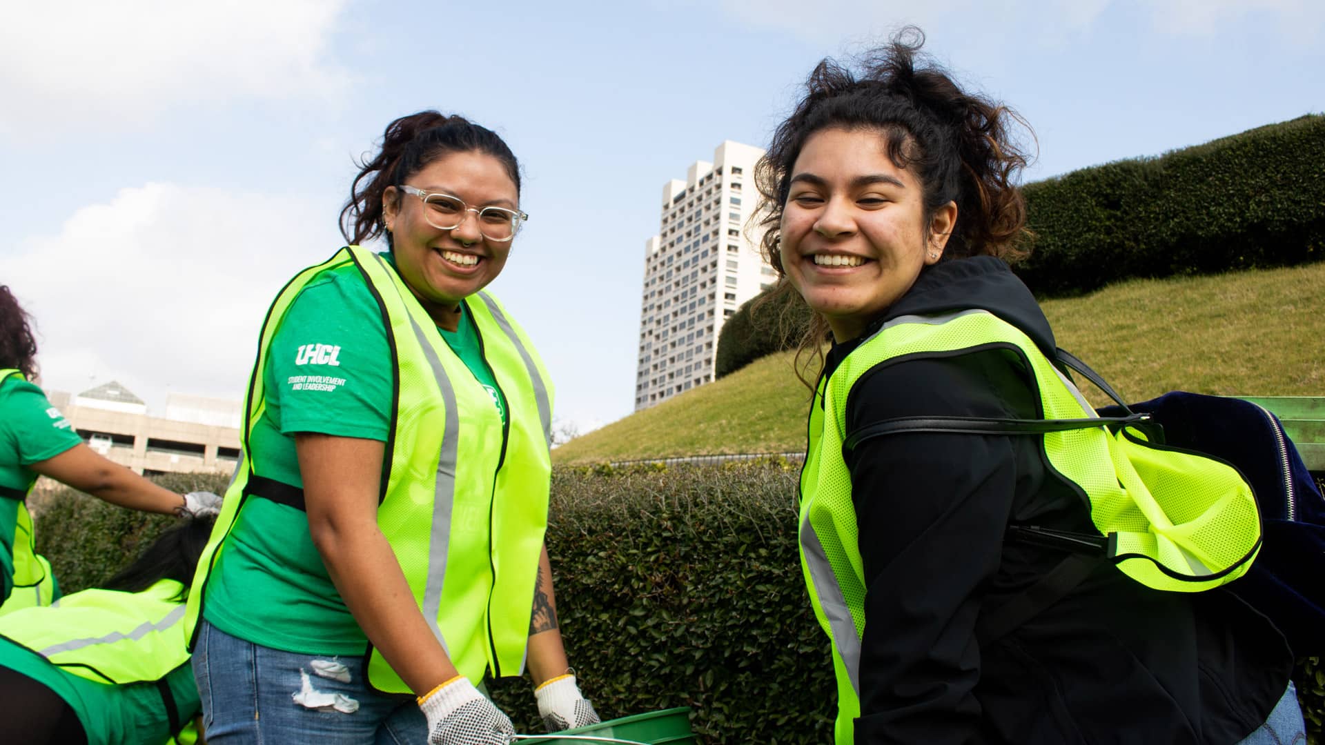 Students in brigh vests volunteering in downtown Houston