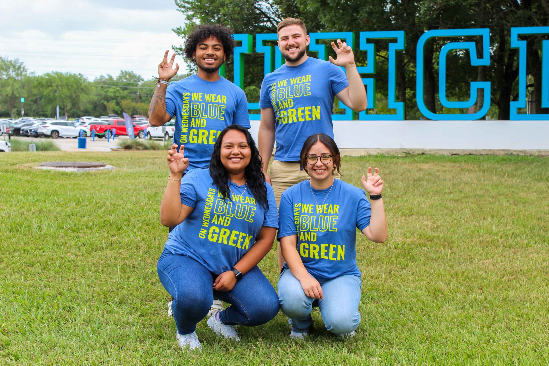 HSTC Student Leaders holding up handsign