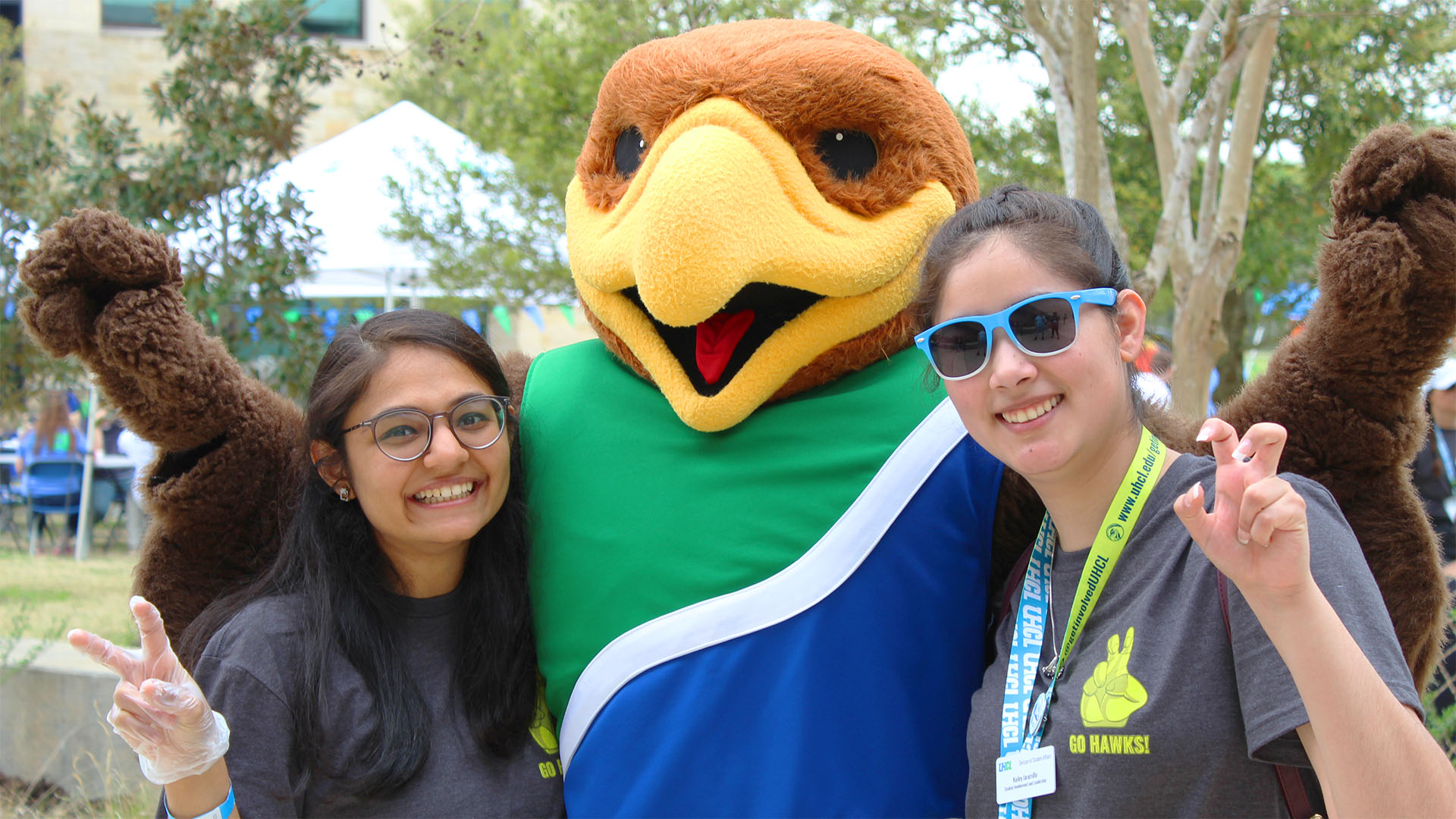 Students posing with Hunter Hawks