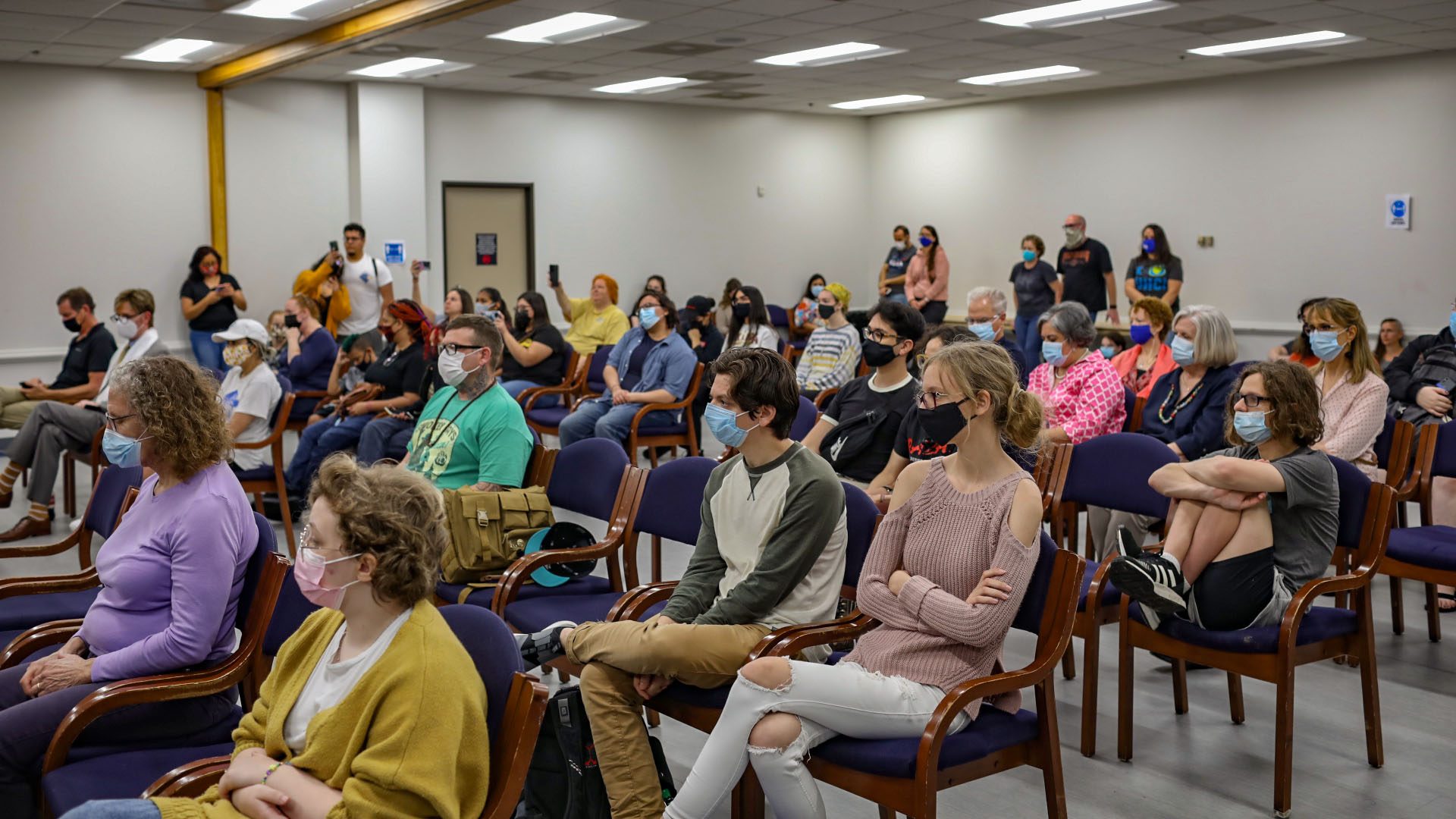 Attendees listening to a speaker