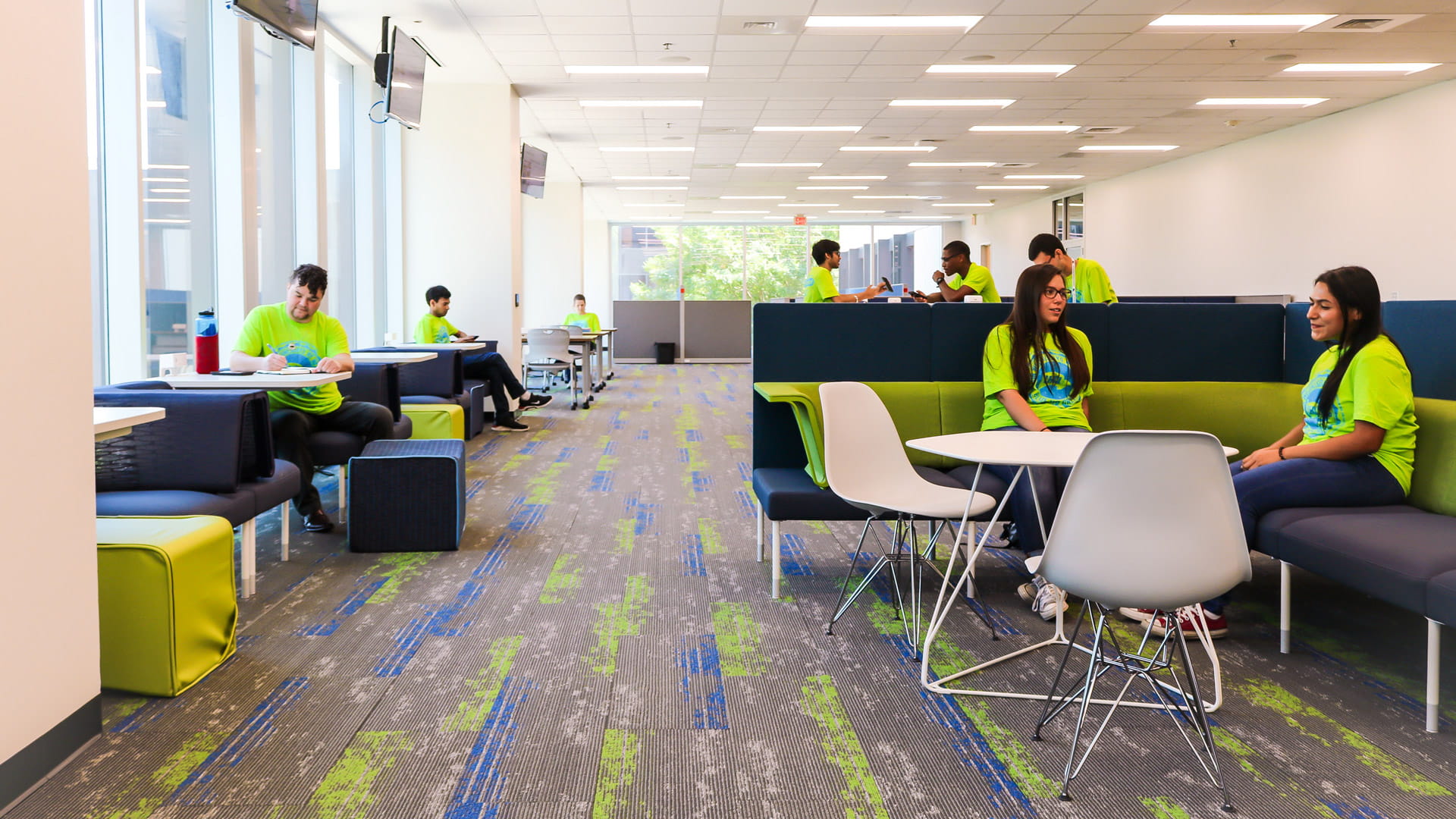 Students writing, reading, and chatting in the SSCB Student Organizatioon Center and Lounge